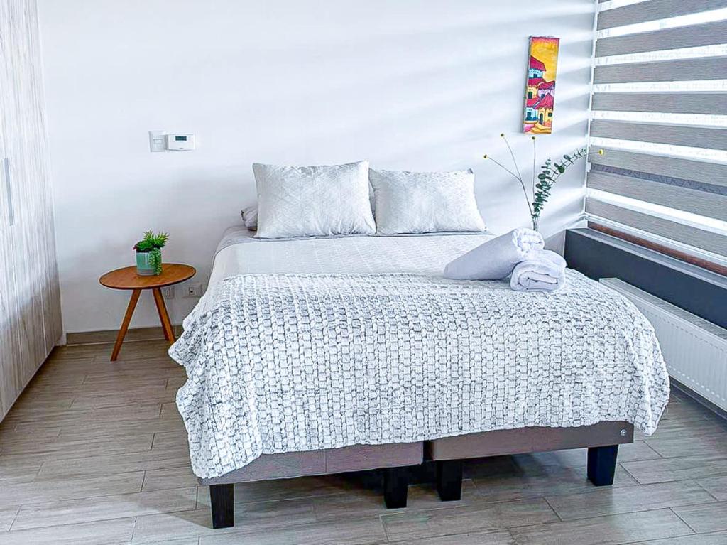 Ένα ή περισσότερα κρεβάτια σε δωμάτιο στο HOM Depto 4PAX con Parking En cerro Baron