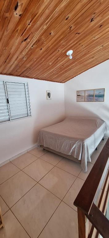 Ένα ή περισσότερα κρεβάτια σε δωμάτιο στο Studio 23 da praia de Maresias