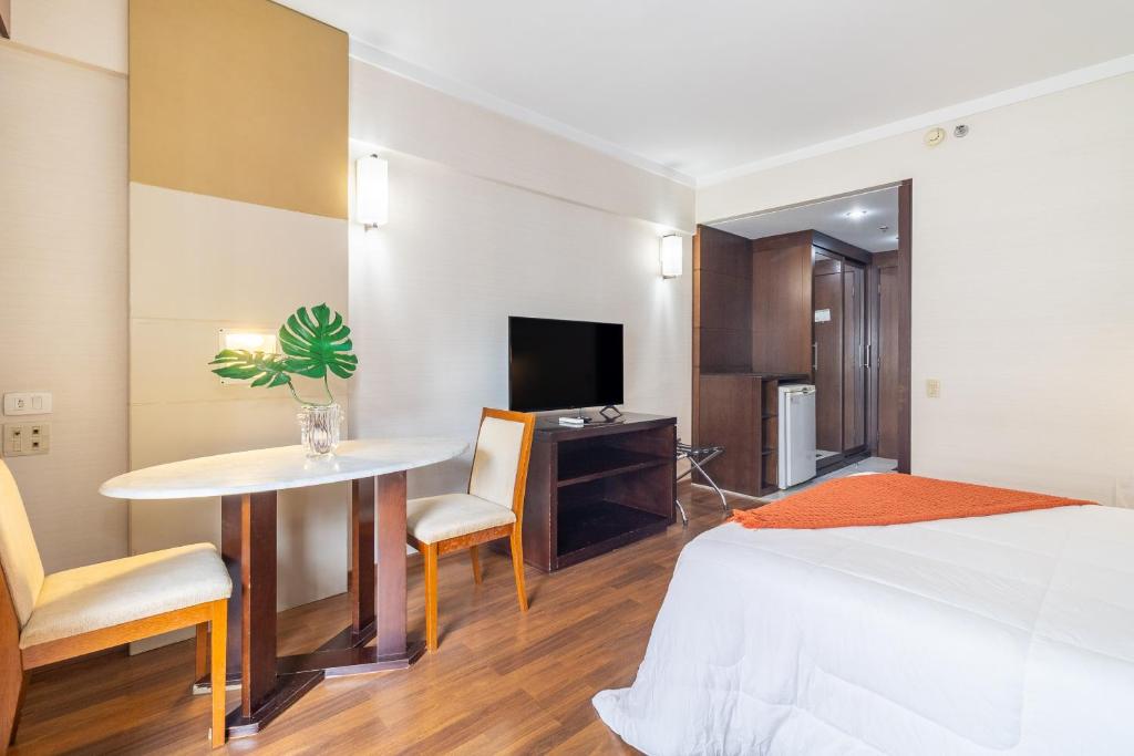 TV a/nebo společenská místnost v ubytování Akile LEONCIO