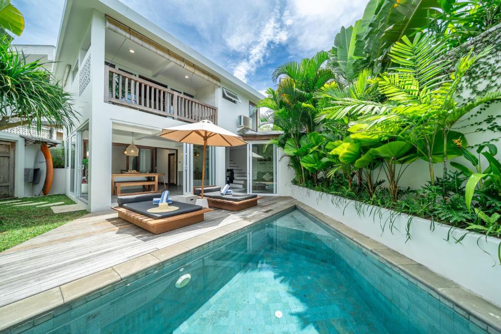 an exterior view of a villa with a swimming pool at Yume Villas in Uluwatu