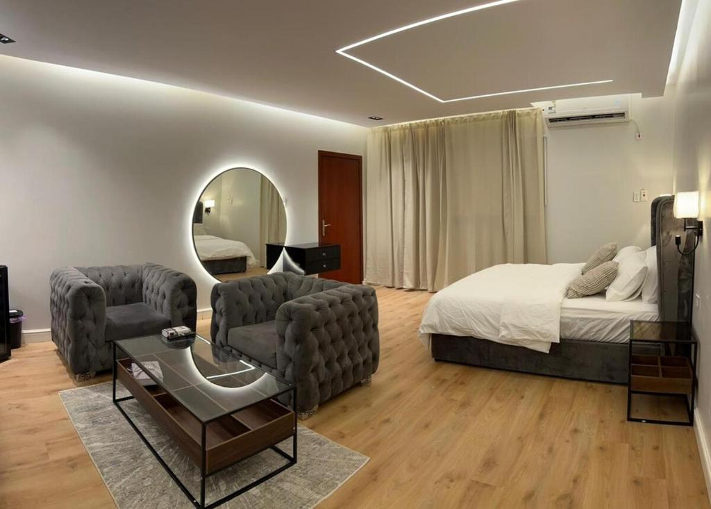 Кровать или кровати в номере استديو النورس 1 -بتصميم عصري بـ دخول ذاتي