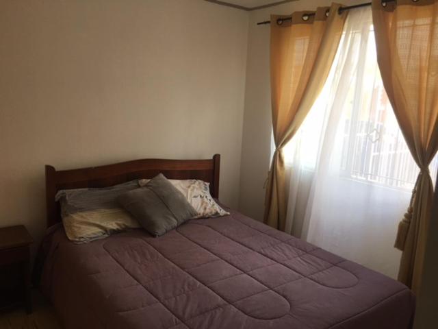 Voodi või voodid majutusasutuse Casa cómoda en Ciudad de La Serena toas