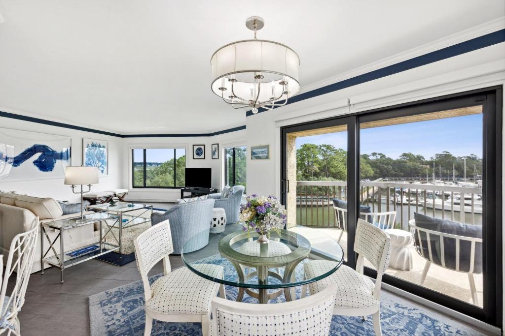 a living room with a glass table and chairs at 236 Captains Quarters in Hilton Head Island