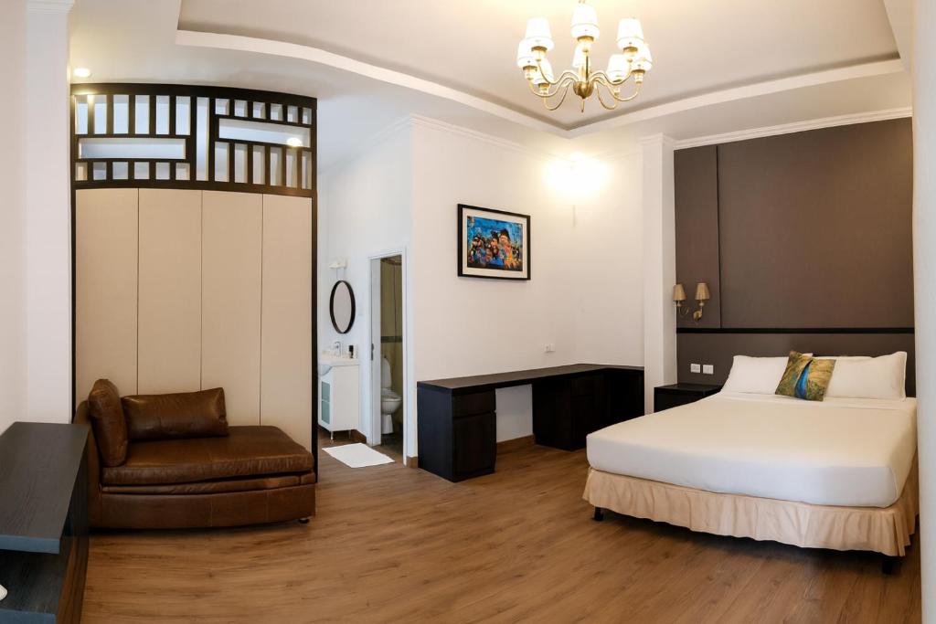 Ένα ή περισσότερα κρεβάτια σε δωμάτιο στο Hotel Purnama Lenggang