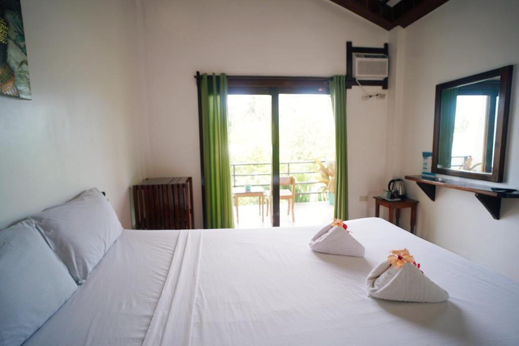 Postel nebo postele na pokoji v ubytování Point 303 Resort