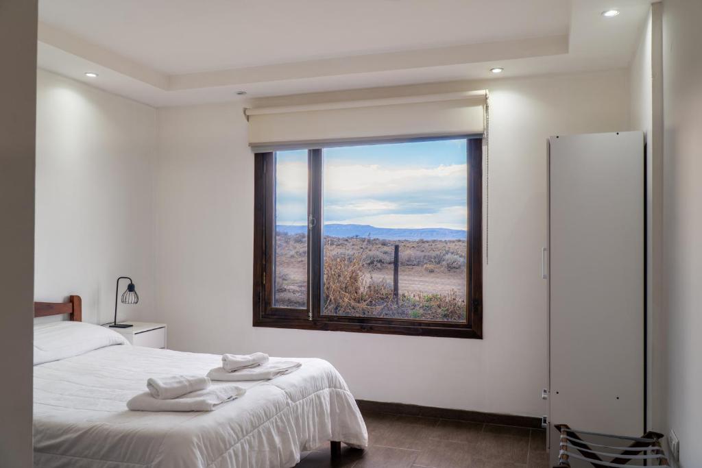 Un pat sau paturi într-o cameră la Casa del viento