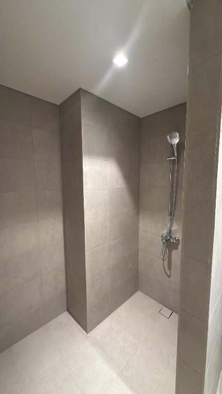 a bathroom with a shower in a room at Noya Viva villa in Abu Dhabi