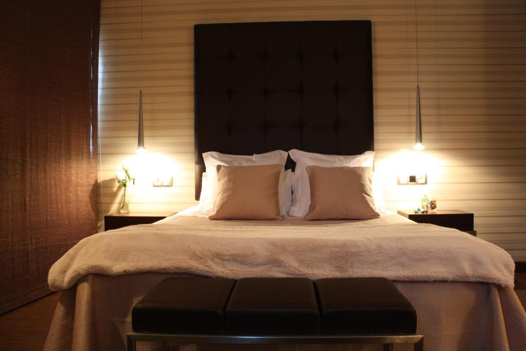 Łóżko lub łóżka w pokoju w obiekcie Hotel Pontes do Eume