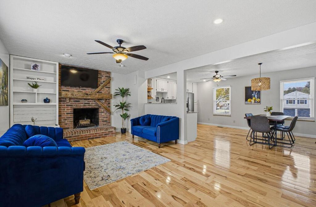 a living room with a blue couch and a fireplace at New 3br home Ready for the Holidays in Dublin