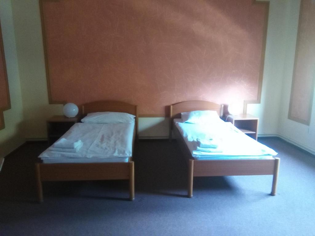 Postel nebo postele na pokoji v ubytování Penzion U Madony