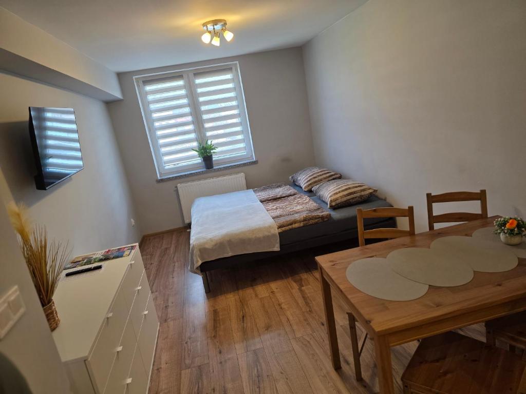 Postel nebo postele na pokoji v ubytování ApartHotel11