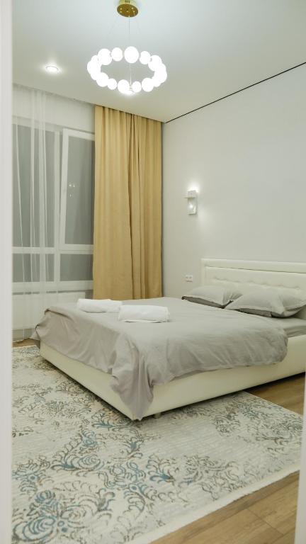 Voodi või voodid majutusasutuse Dauletti Qalashyq toas