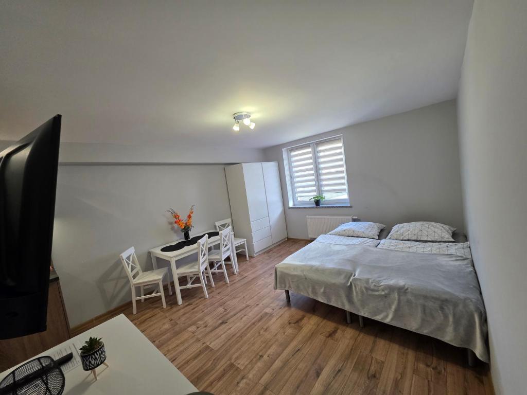 Postel nebo postele na pokoji v ubytování ApartHotel10