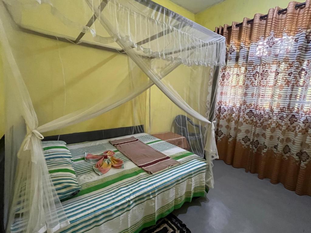 Ένα ή περισσότερα κρεβάτια σε δωμάτιο στο Mahiru Homestay