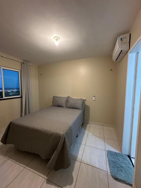 Ένα ή περισσότερα κρεβάτια σε δωμάτιο στο Cobertura 403 - Morro Branco