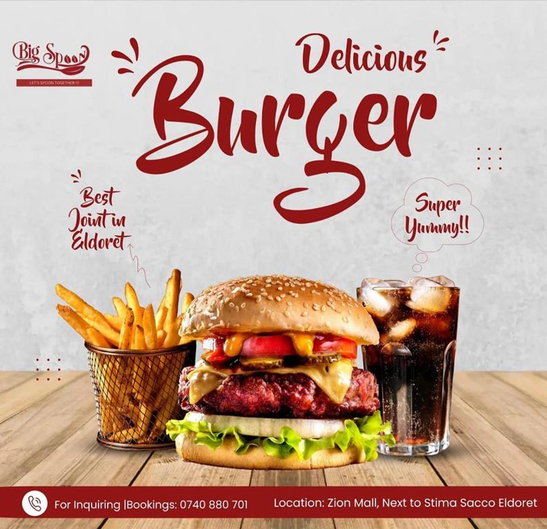 a billboard of a hamburger and fries and a drink at Big Spoon Cafe in Eldoret