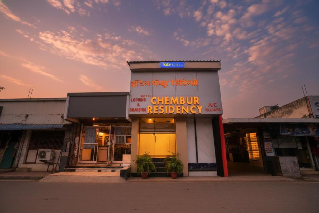 a building with a sign for a culinary restaurant at Via Chembur Residency in Mumbai