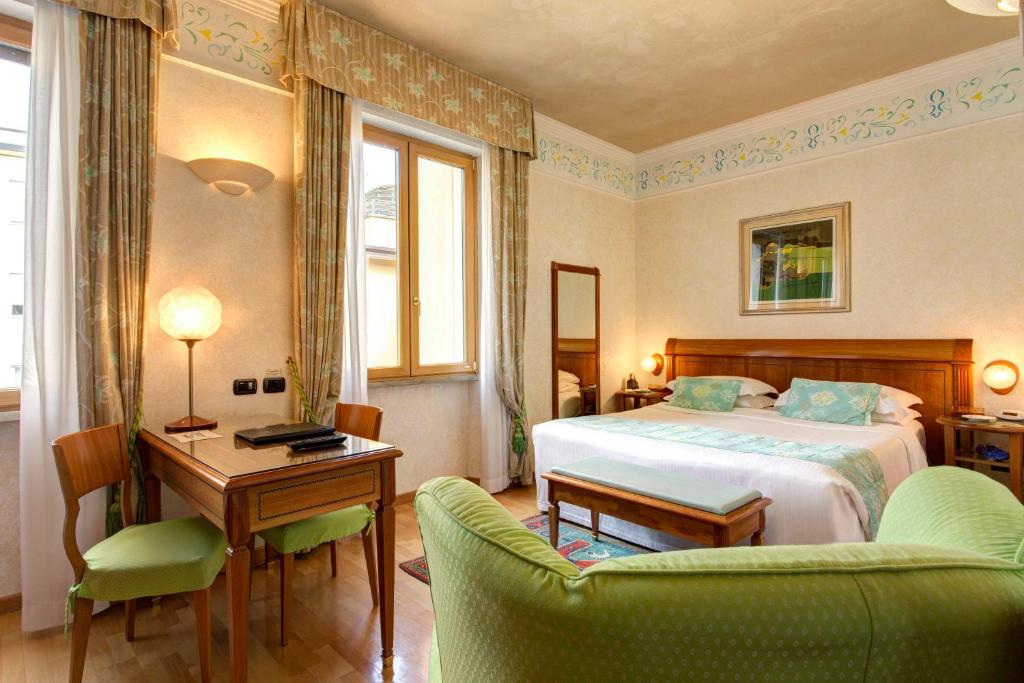 Postel nebo postele na pokoji v ubytování Hotel Firenze