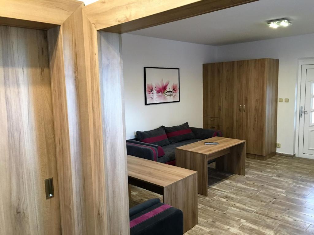 a living room with a couch and a table at Apartment Šárka in Strupčice