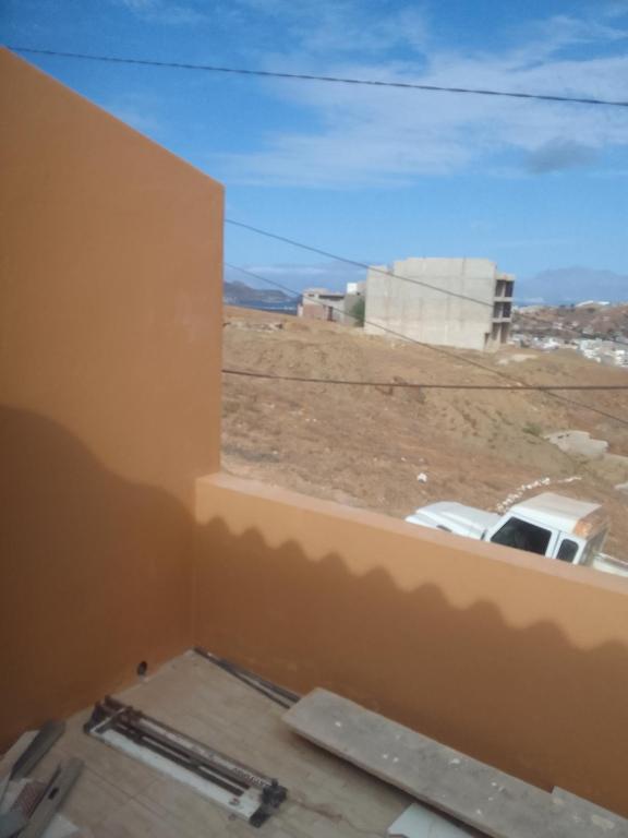 a view from a window of a parking lot at Ma maison de cha de marhina in Mindelo
