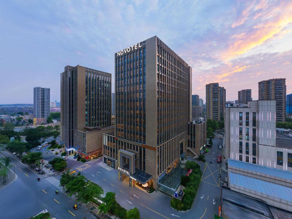 an aerial view of a city with tall buildings at Novotel Hangzhou Xintiandi in Hangzhou