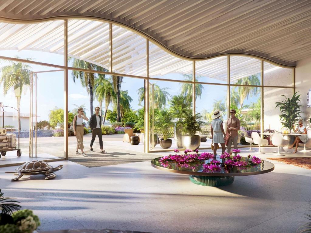 Een impressie van een lobby met een fontein met bloemen. bij SLS The Red Sea in Ḩanak