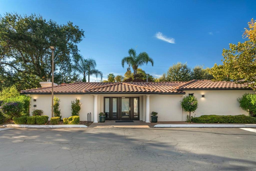a house with a tile roof at University Park Inn & Suites, an Ascend Collection Hotel in Davis