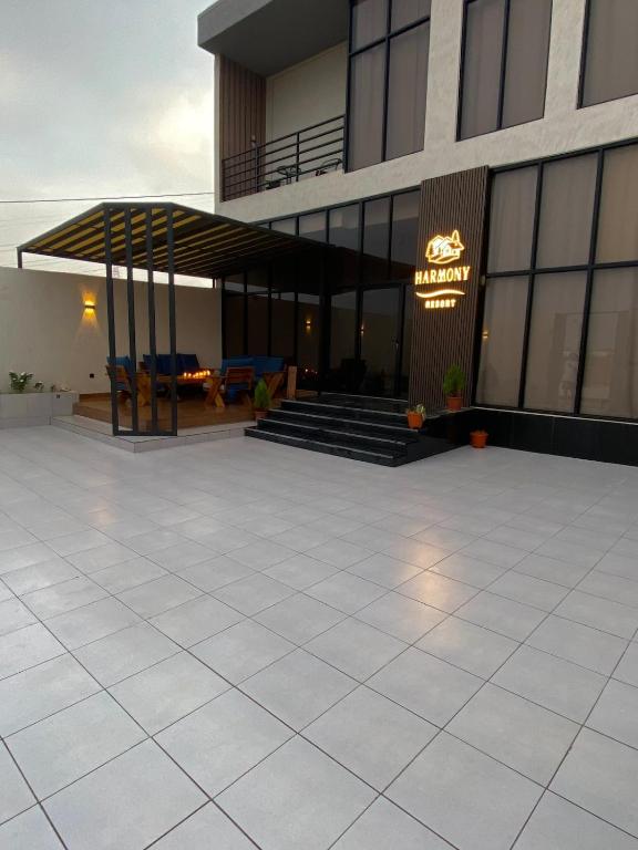 a building with a large patio with stairs and a building at albaha harmony resort in Al Baha