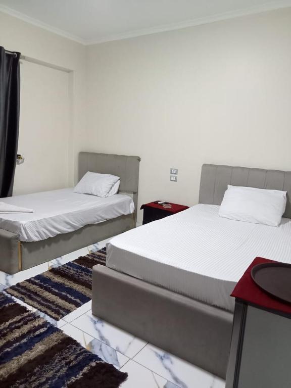 A bed or beds in a room at NEW Hostel pyramids