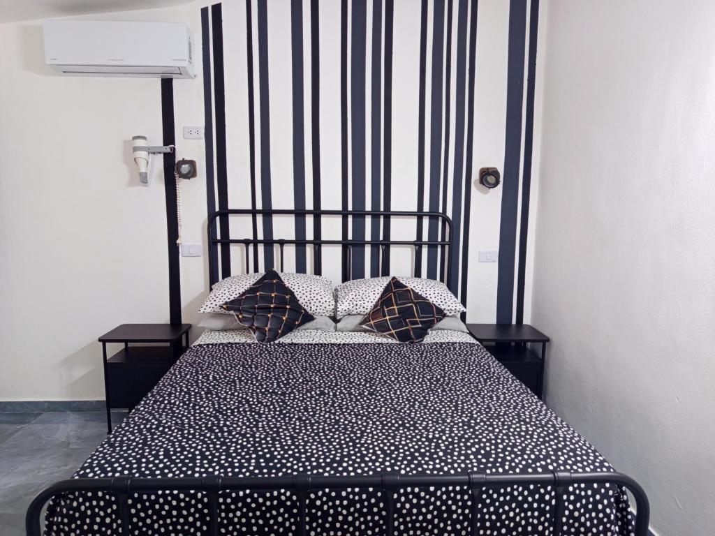 Ένα ή περισσότερα κρεβάτια σε δωμάτιο στο Italiana Hogares