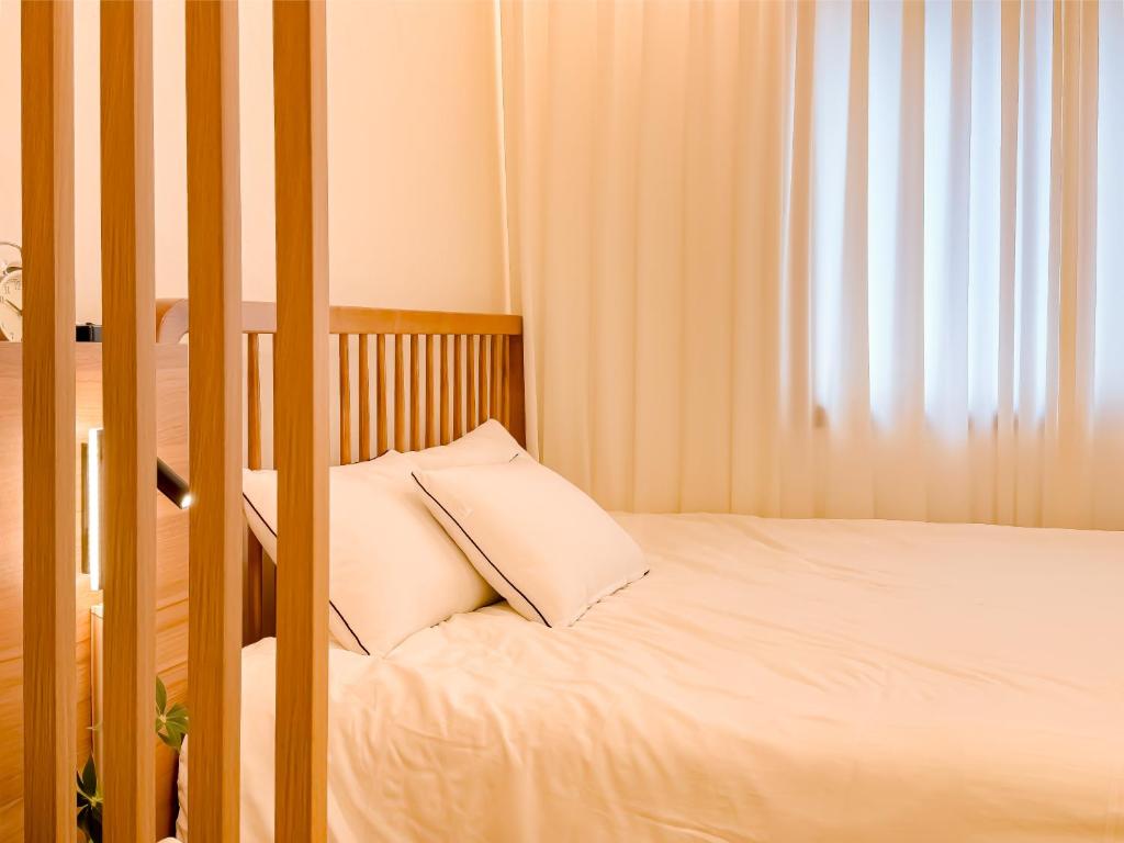 Postel nebo postele na pokoji v ubytování 스테이 하나 용산