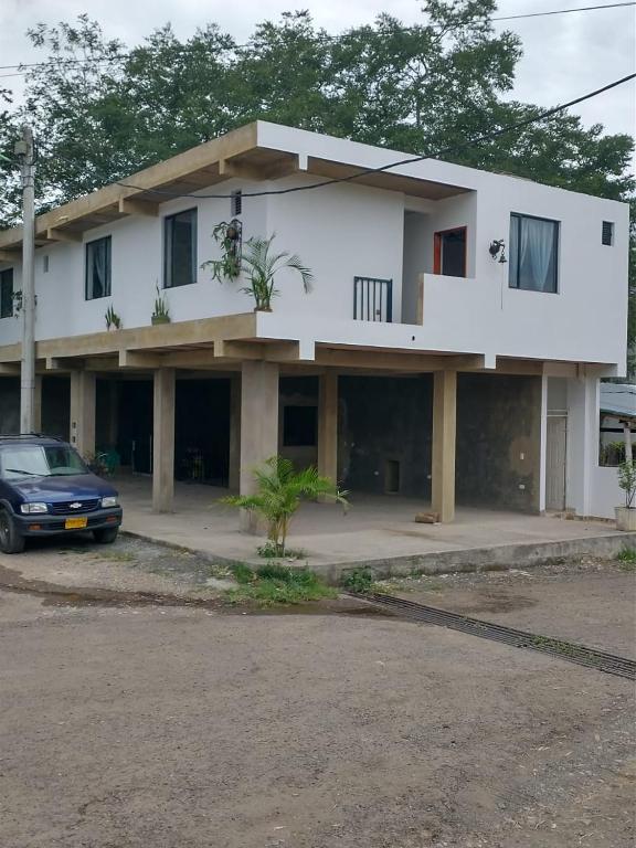 a house with a car parked in front of it at Rosablanca RN in Guaduas