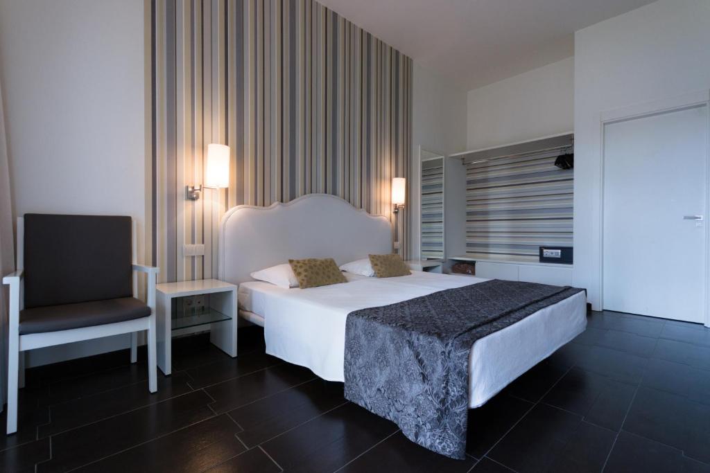 Postel nebo postele na pokoji v ubytování Ouril Pontao Hotel