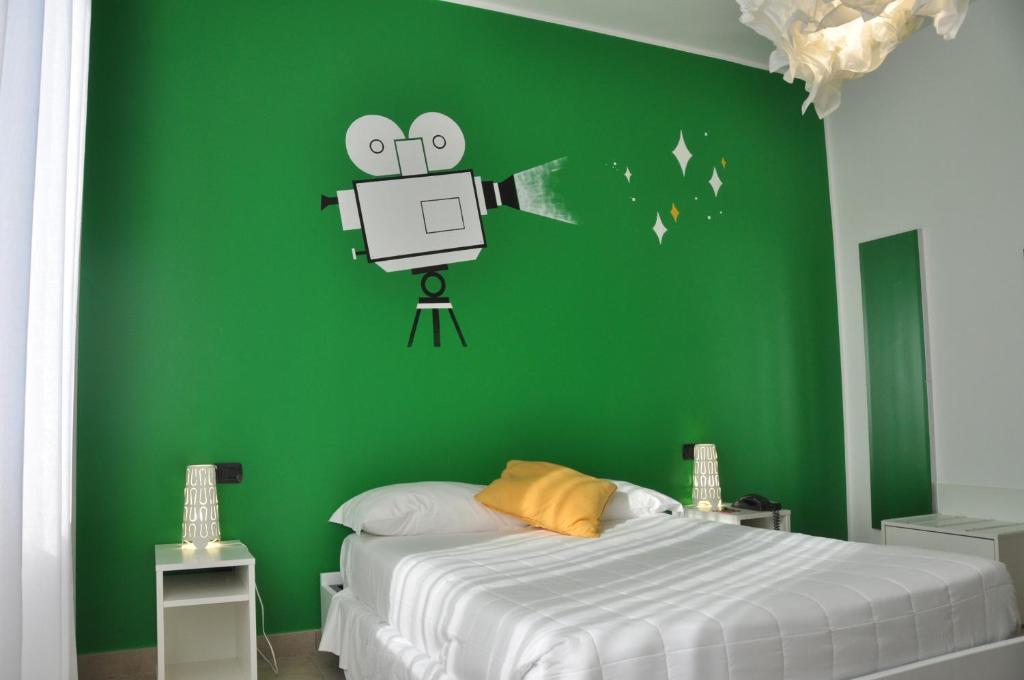 Postel nebo postele na pokoji v ubytování Lo Scoiattolo Piedmont Bike Hotel