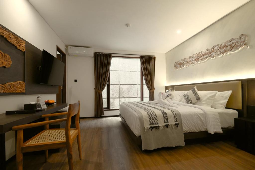 Postel nebo postele na pokoji v ubytování Catra Wellness Hotel Ubud