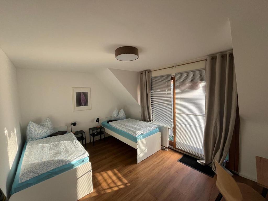 Postel nebo postele na pokoji v ubytování Appartment Haus Rothenhaus Hamburg