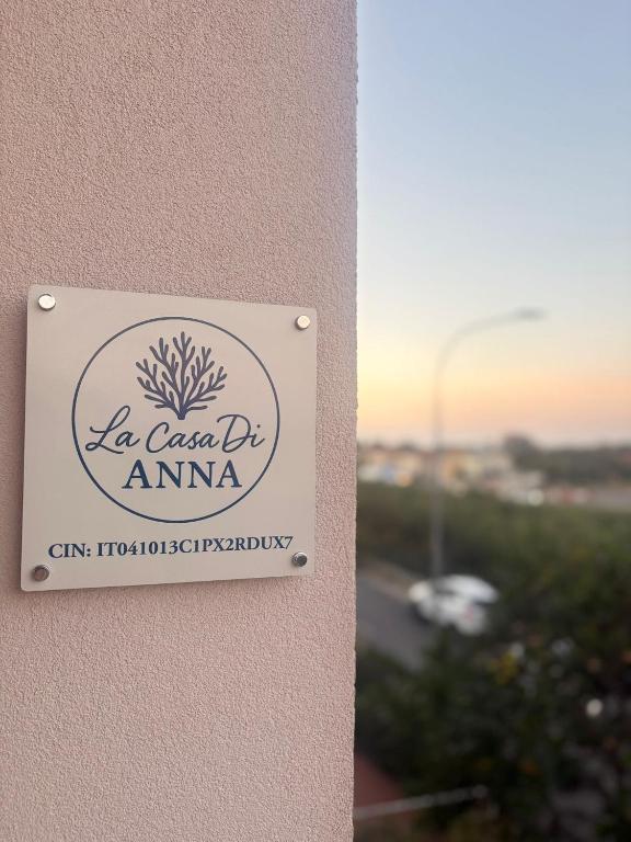 a sign on the side of a building at La Casa di Anna in Fano