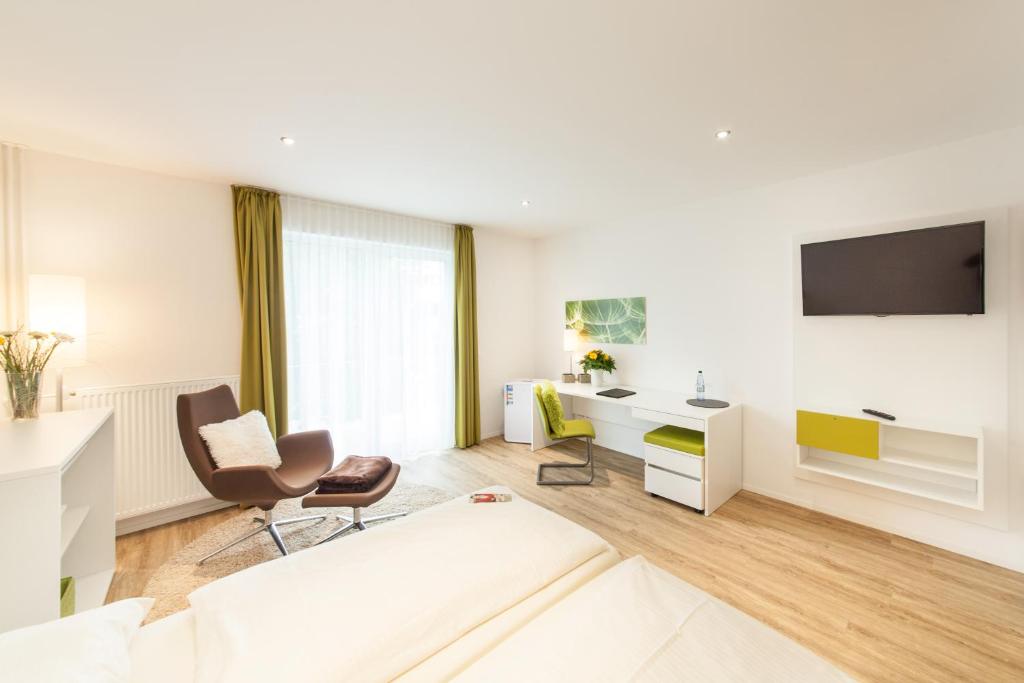 TV a/nebo společenská místnost v ubytování Candlewood Suites Fürth by IHG