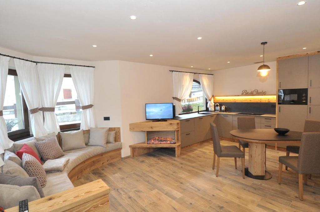 a living room with a couch and a table at Borch Chalet - Exclusive Apartments in Livigno