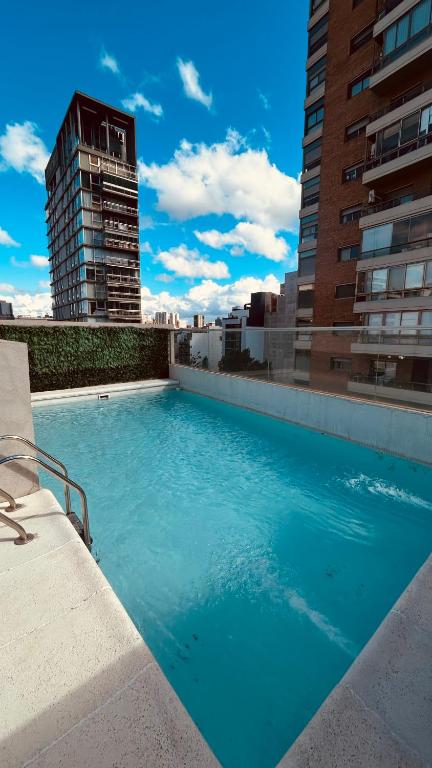 a large swimming pool on top of a building at Rent Montañeses Nuñez in Buenos Aires