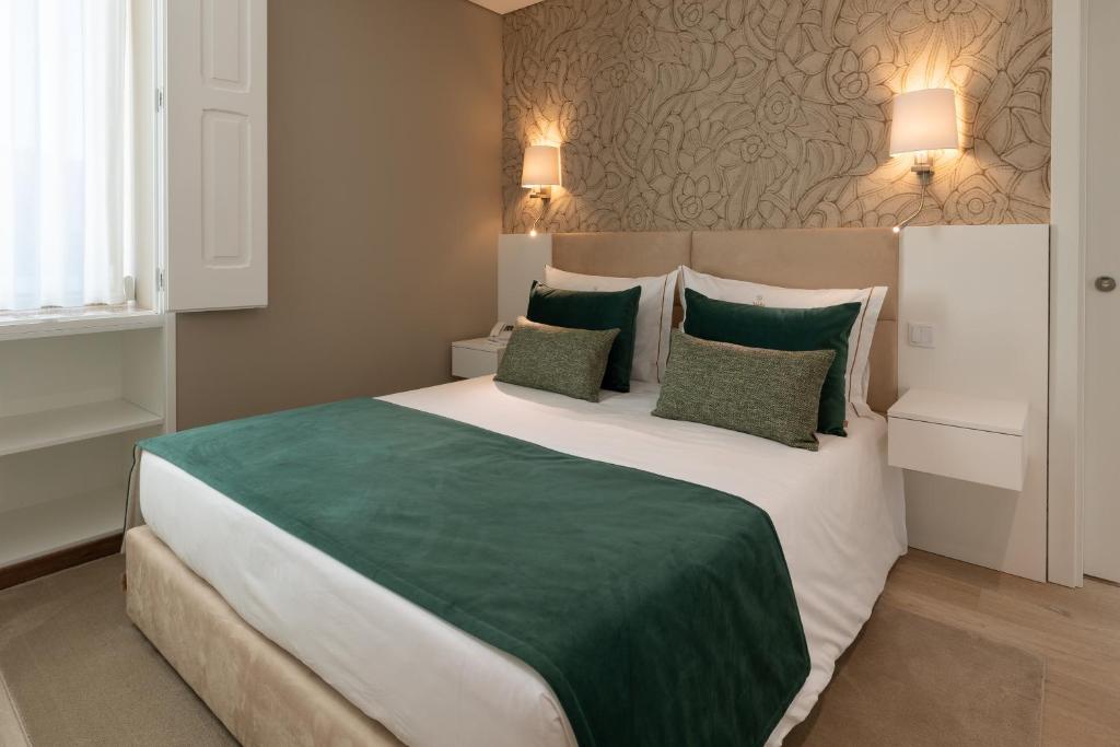 Ένα ή περισσότερα κρεβάτια σε δωμάτιο στο Stella Braga Aparthotel