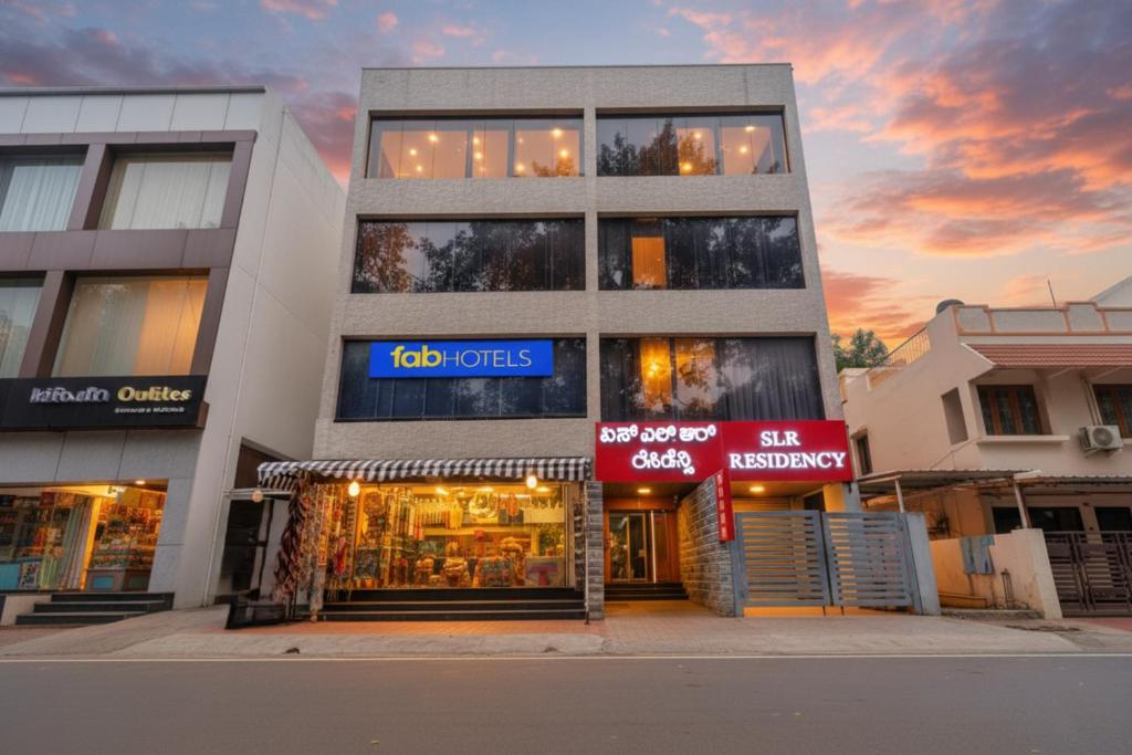 a building with a store in front of it at FabHotel SLR Residency - AECS Layout, Brookefield in Bengaluru