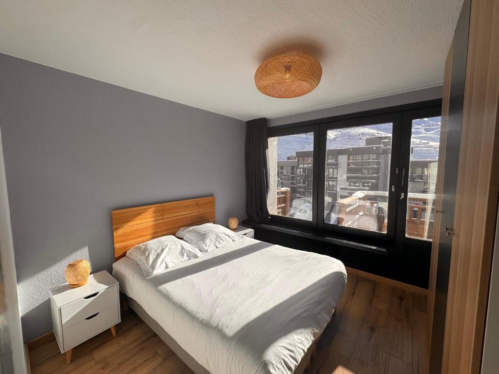 Postel nebo postele na pokoji v ubytování Panorama des Neiges