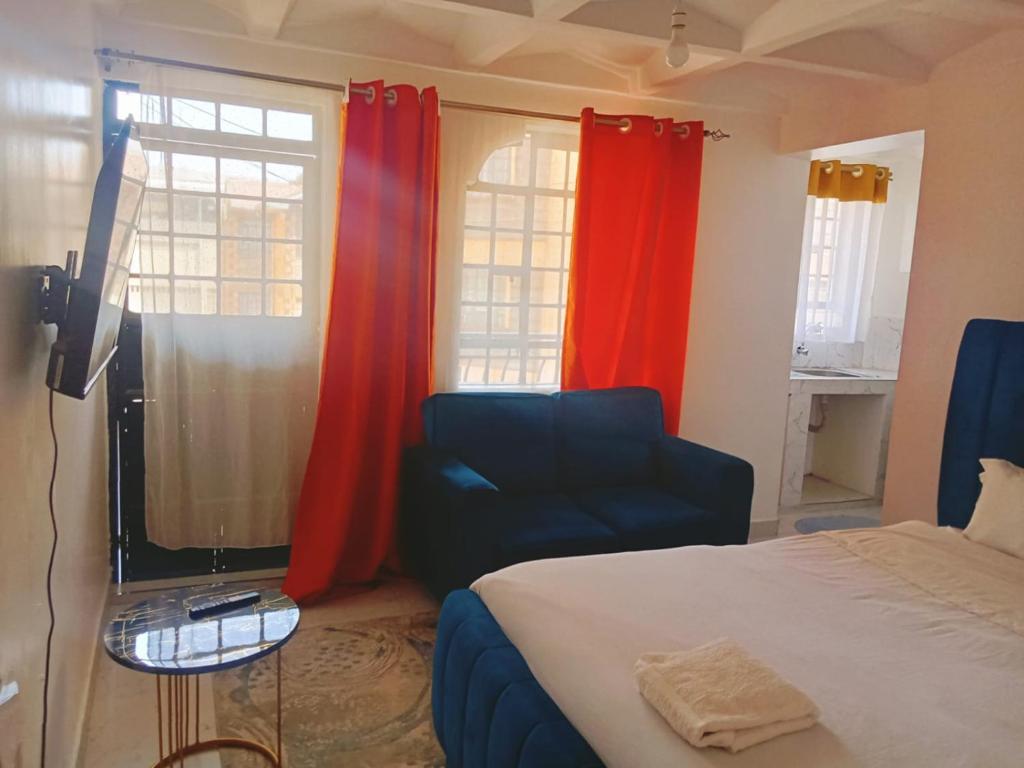 Ένα ή περισσότερα κρεβάτια σε δωμάτιο στο Studio Apartment Roysambu TRM Drive Thika Road