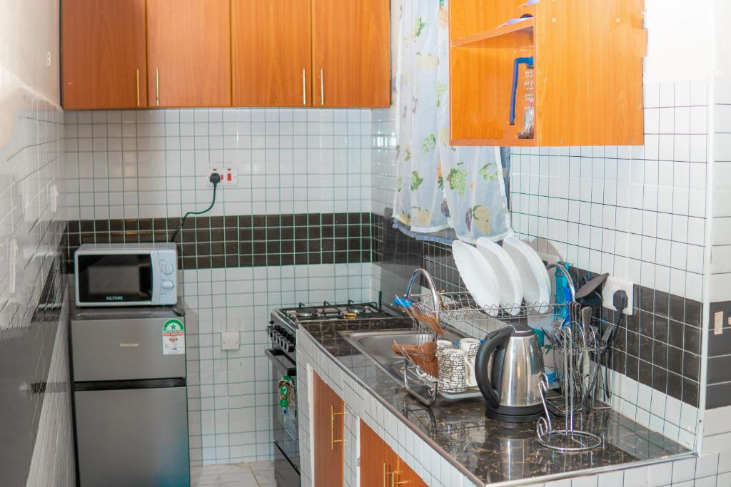 Kuchyň nebo kuchyňský kout v ubytování Qwetuhomes