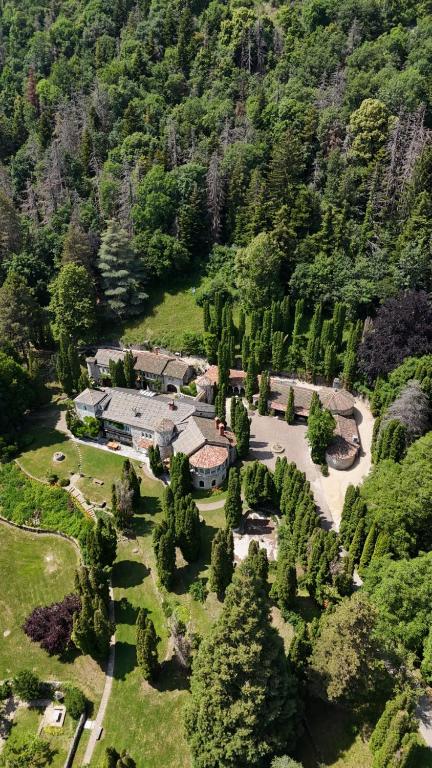 an aerial view of a house in a mountain at Beauregard Jura - Peaceful Estate Stays Near Geneva in Gex