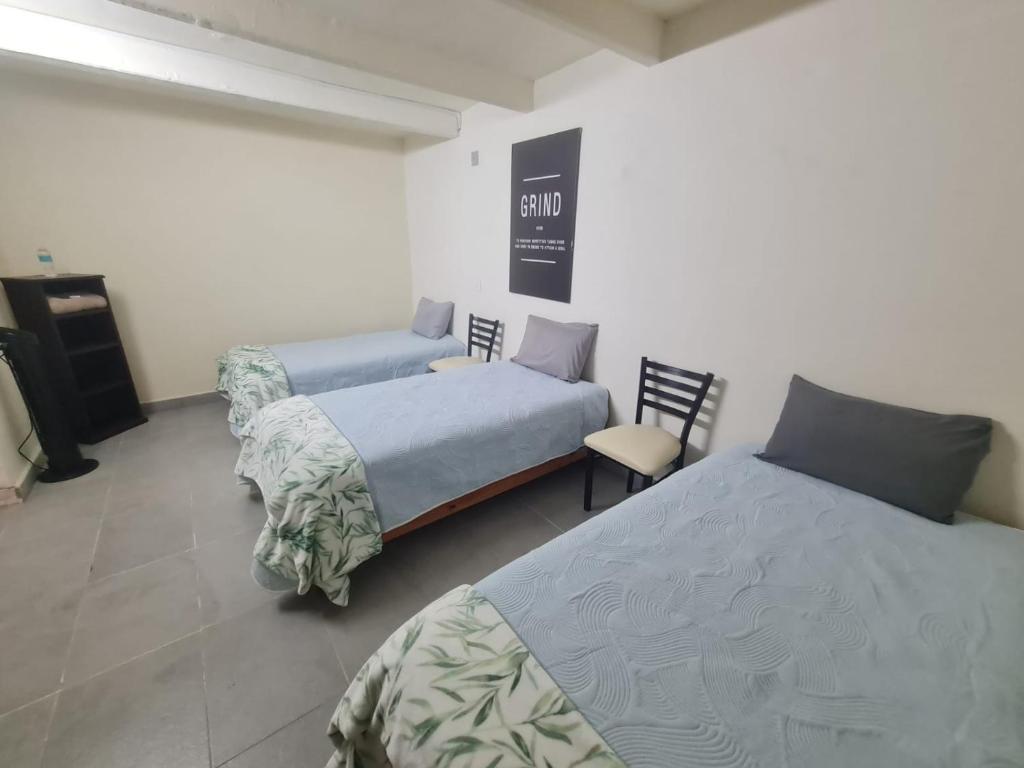 Una cama o camas en una habitación de Hostal Casa Gavilán