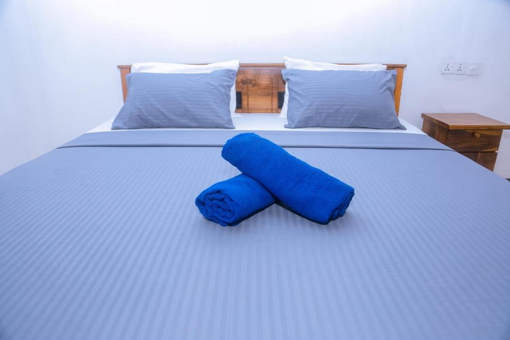 Postel nebo postele na pokoji v ubytování Good Home Mirissa