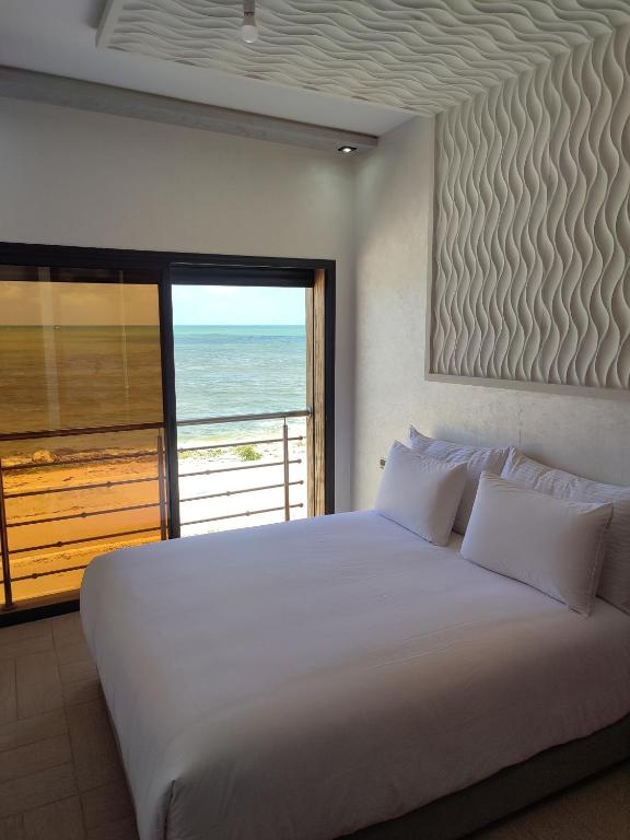 Ένα ή περισσότερα κρεβάτια σε δωμάτιο στο Horizon bleu