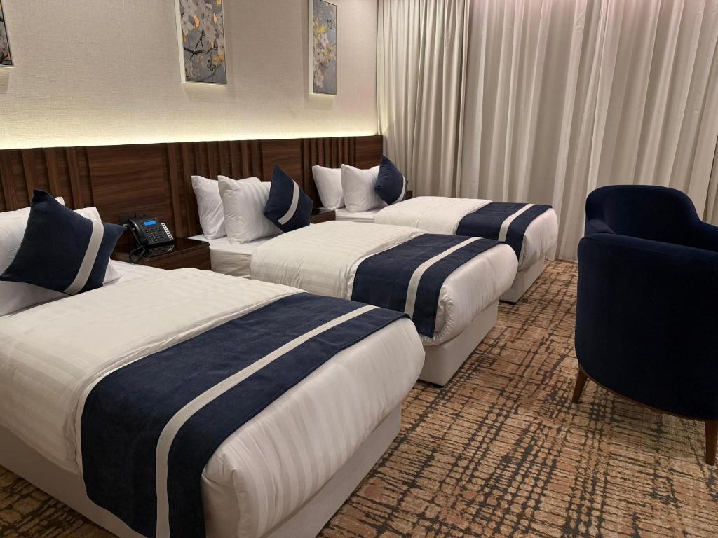 Postel nebo postele na pokoji v ubytování شقق العزيزية العلا